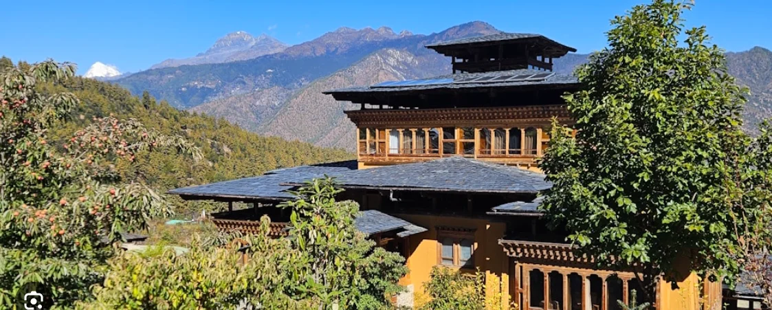 Carved wooden window detail at a traditional bhutan hotel — bhutan hotels interior design